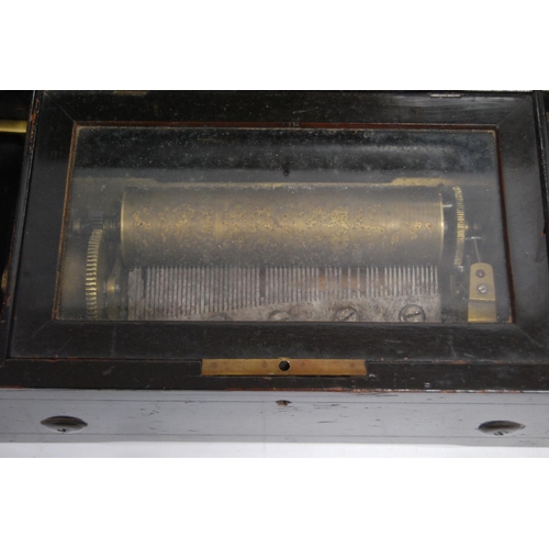 128 - Late 19th century inlaid rosewood music box, the glazed panel enclosing a single cylinder, 11.5cm hi... 