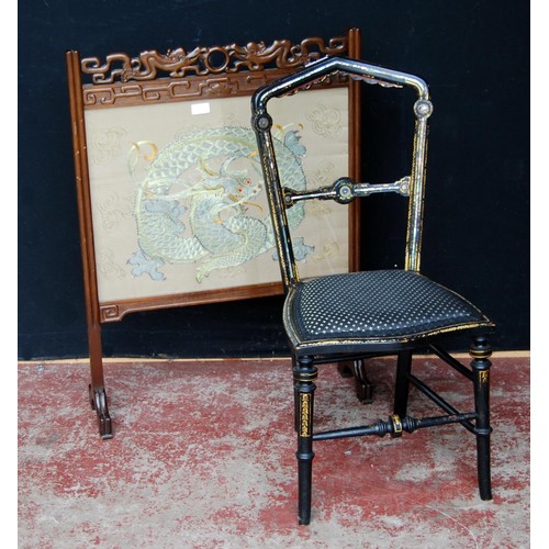 329 - Chinese hardwood firescreen, decorated with an embroidered panel of a dragon, beneath glass, 86cm hi... 