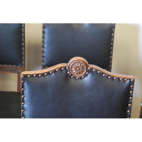 319 - Oak ten-piece dining room suite, comprising a sideboard, pull-out extending dining table and eight c... 