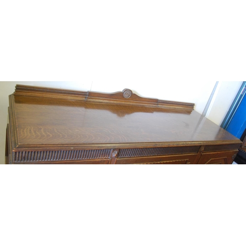 319 - Oak ten-piece dining room suite, comprising a sideboard, pull-out extending dining table and eight c... 