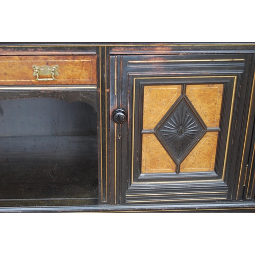 323 - Late 19th century Aesthetic Movement ebonised and walnut drawing room cabinet, the top section with ... 