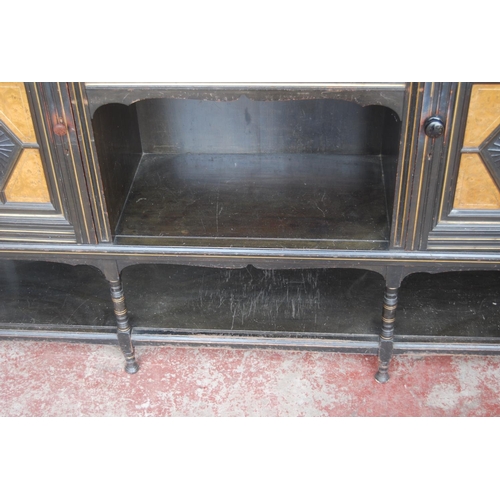 323 - Late 19th century Aesthetic Movement ebonised and walnut drawing room cabinet, the top section with ... 