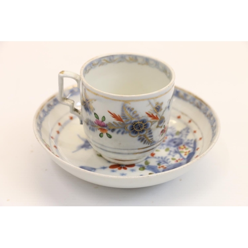 14 - Antique cup and saucer with tobacco leaf style pattern.