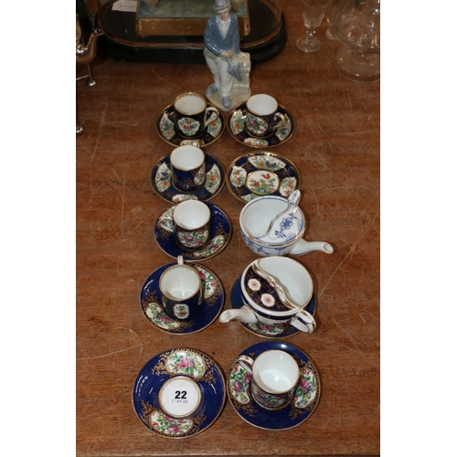 22 - Booths coffee cans and saucers, retailed by T Goode & Co., a Spanish model of a clown, and two t... 