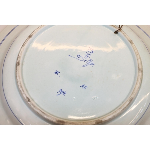 23 - Delft floral decorated charger, 34cm diameter.