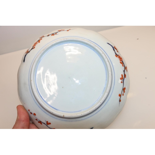 26 - Oriental dish decorated with ducks and flowers, 21.5cm diameter.