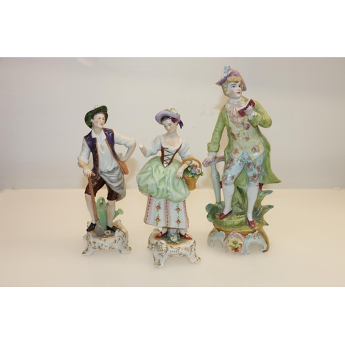 32 - Three continental porcelain figures, two marked to base.