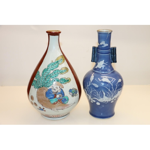 34 - Oriental onion shaped vase decorated with seated gentleman, 24cm and a blue and white twin bamboo ha... 