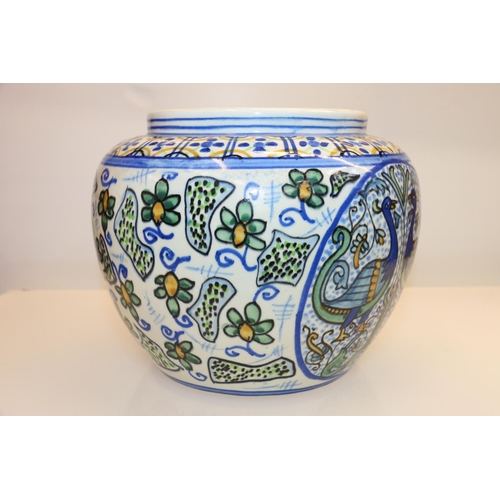 38 - Scottish Pottery jardiniere or vase decorated with birds and flowers, 19cm.