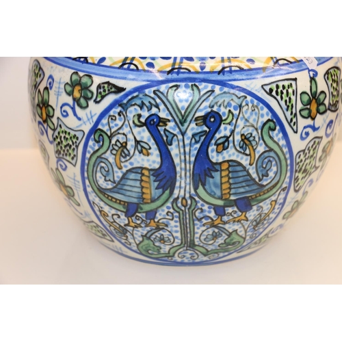 38 - Scottish Pottery jardiniere or vase decorated with birds and flowers, 19cm.