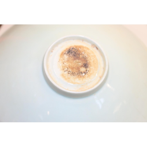 39 - Pair of oriental celadon ground bowls, 21cm.