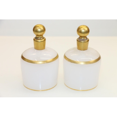 42 - Pair of 19th century milk glass scent bottles with gilt decoration.