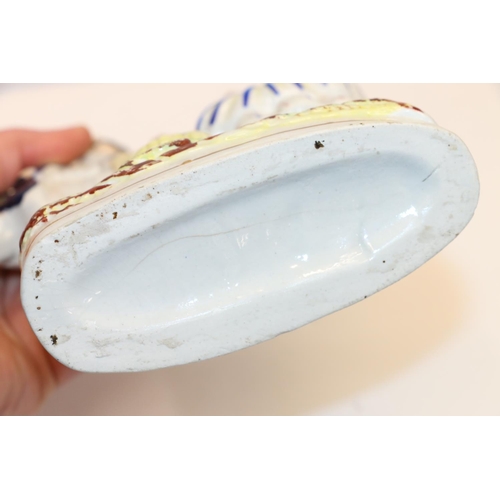 53 - Staffordshire model of a standing couple, 23cm.