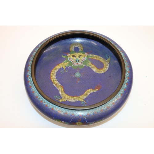 54 - Chinese cloisonne bowl decorated with a yellow dragon on blue ground, 26cm diameter.