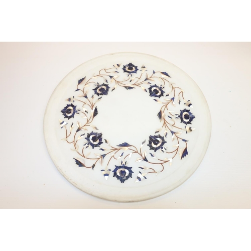55 - Hardstone plate decorated with inlaid mother-of-pearl and agate floral design, 30cm diameter,
