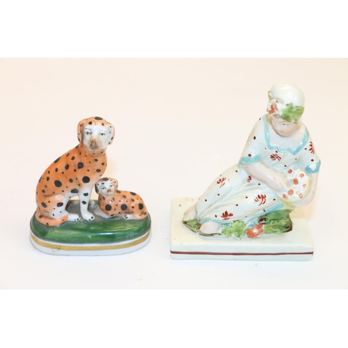 56 - 19th century Chelsea Pottery model of a dog and a pup, and a 19th century style model of a seated fe... 