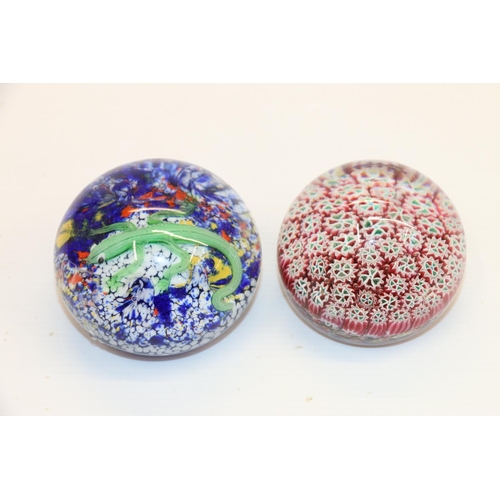 58 - Glass paperweight decorated with a lizard, and another.