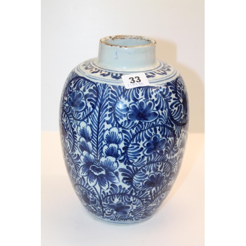 33 - Oriental blue and white vase decorated with flowers, 25cm.