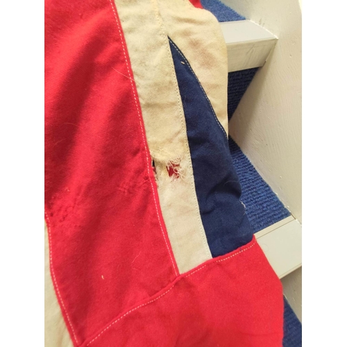 440 - Royal White Ensign flag from HMS Hood together with a plaque depicting a bird with anchor in claw wi... 