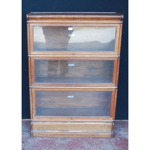 338 - Globe Wernicke oak stacking bookcase, with three glazed sections, on base, with label to each sectio... 
