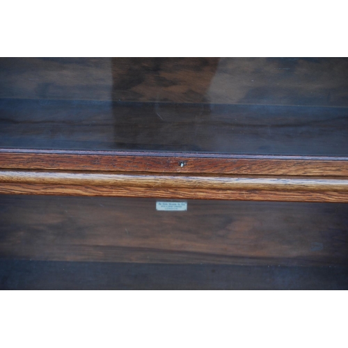 338 - Globe Wernicke oak stacking bookcase, with three glazed sections, on base, with label to each sectio... 