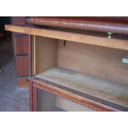 339 - Globe Wernicke oak stacking bookcase, with three glazed sections, on base, with label to each sectio... 