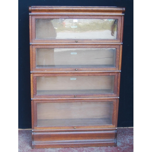 340 - Globe Wernicke oak stacking bookcase, with four glazed sections, on base, with label to each section... 