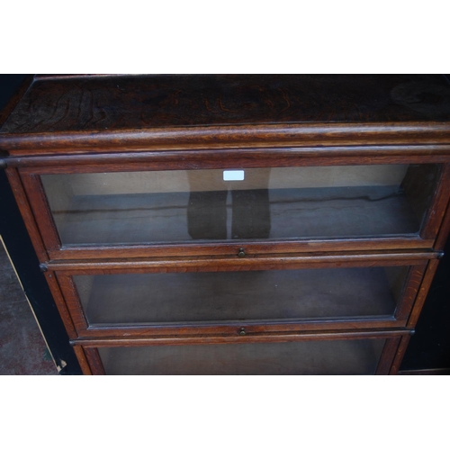 340 - Globe Wernicke oak stacking bookcase, with four glazed sections, on base, with label to each section... 