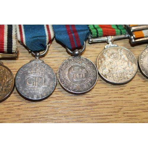 447 - Miniature medals including Victoria Cross, OBE, Boer War Queen's South Africa medal with South Afric... 