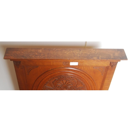 347 - English School: carved oak fire screen, carved with a floral cartouche to the centre, flanked by flo... 