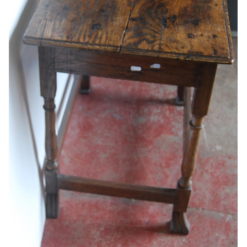 368 - George III oak lowboy, the rectangular plank top above a long drawer and shaped apron, on turned sup... 