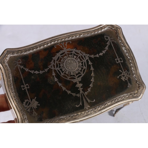 1 - Sterling silver bijouterie casket, with inlaid tortoiseshell cover, raised on straight leg supports,... 