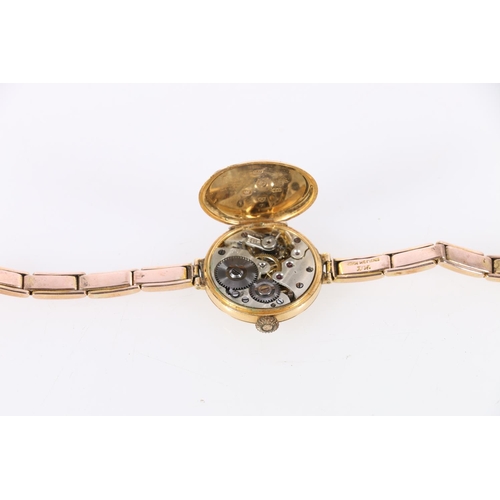 121 - 18ct gold cased lady's wristwatch on 9ct gold strap, 24.6g gross.