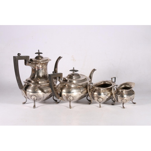 13 - George V sterling silver four piece tea service, with wavy edge rim, on cabriole pad supports, Walke... 