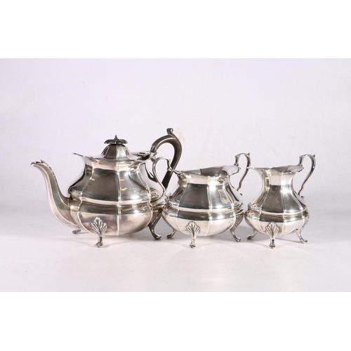 14 - George V sterling silver three piece tea service, the reeded body on shaped cabriole legs, Albert He... 