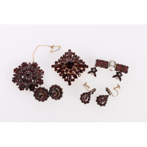 141 - Pair of 9ct gold mounted garnet set earrings, 4.6g, another pair, a bar brooch and two others. 