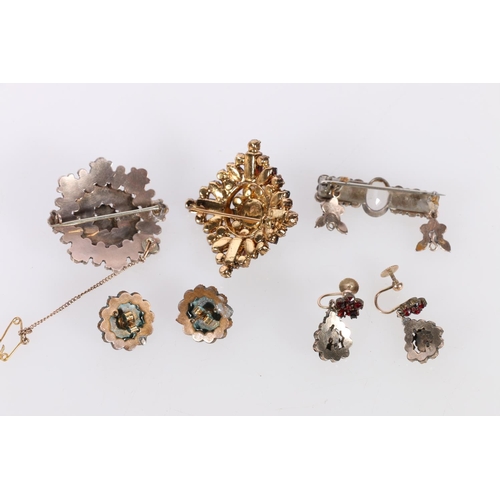 141 - Pair of 9ct gold mounted garnet set earrings, 4.6g, another pair, a bar brooch and two others. 