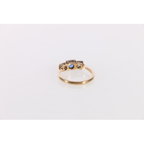 142 - Gold sapphire and diamond three stone ring in the Art Deco manner, the central faceted sapphire flan... 