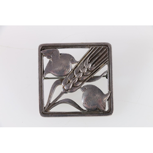 148 - Georg Jensen of Denmark, a Danish silver brooch designed by Arno Malinowski, modelled as two birds a... 