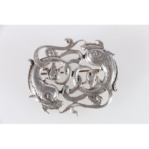 149 - Scottish Arts & Crafts style silver brooch modelled as two fish in a scrolling frame, makers mar... 