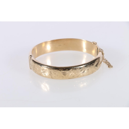 152 - Ladies 9ct gold floral half engraved bangle, Birmingham, maker RPH Jewellery Company Ltd, 16g, 6cm d... 