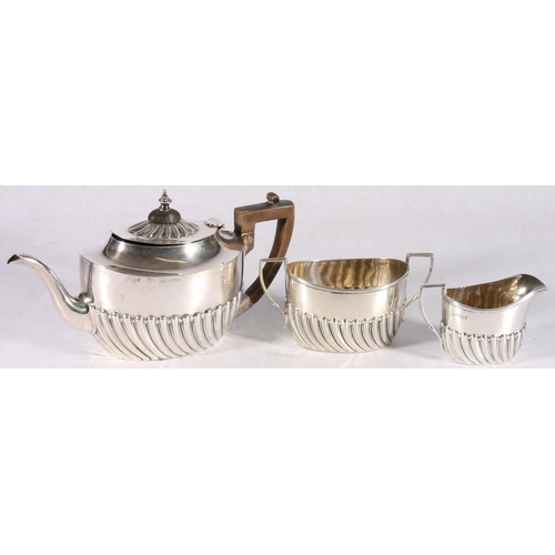 17 - Victorian sterling silver three piece bachelor's tea service, with reeded body, Harrison Brother &am... 