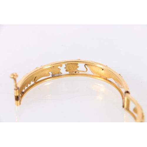 186 - Chinese gold bangle with pierced dragon chasing flamming pearl design, two character marks to interi... 