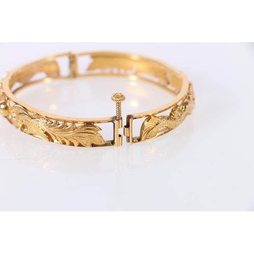 186 - Chinese gold bangle with pierced dragon chasing flamming pearl design, two character marks to interi... 