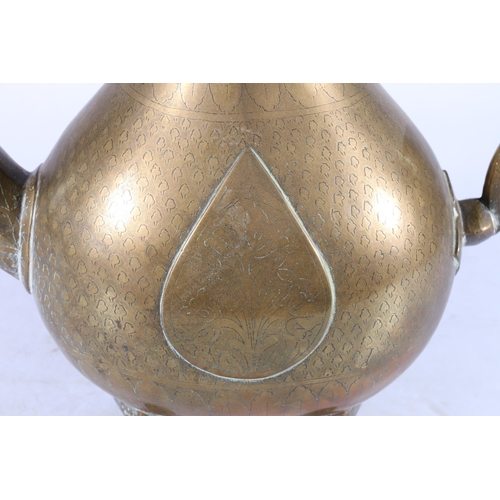 351 - A 19th century Iranian brass coffee pot of pear shape raised on four suppports with tapering hexagon... 