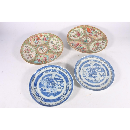 373 - A pair of 19th century Canton famille rose dishes decorated with four panels of figures, flowers, bi... 