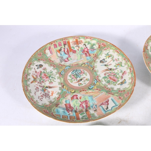 373 - A pair of 19th century Canton famille rose dishes decorated with four panels of figures, flowers, bi... 