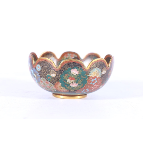 392 - A Japanese cloisonne bowl with petal edge and gilt metal wires, decorated with various shaped panels... 