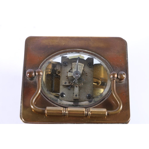 402 - Brass four glass carriage clock, with carry handle and white dial with Roman numerals, 13cm high.