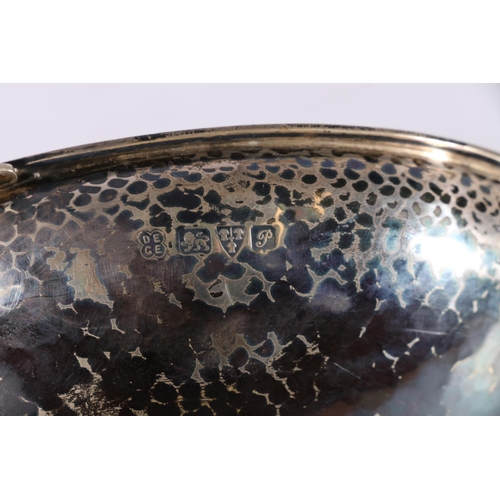 41 - George V sterling silver twin handled bowl, the hammered body flanked by Fox and foliate decorated h... 